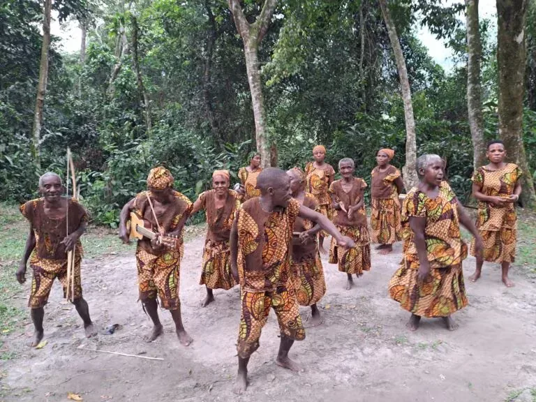 A Batwa community elder leading a cultural trail in the Bwindi highlands